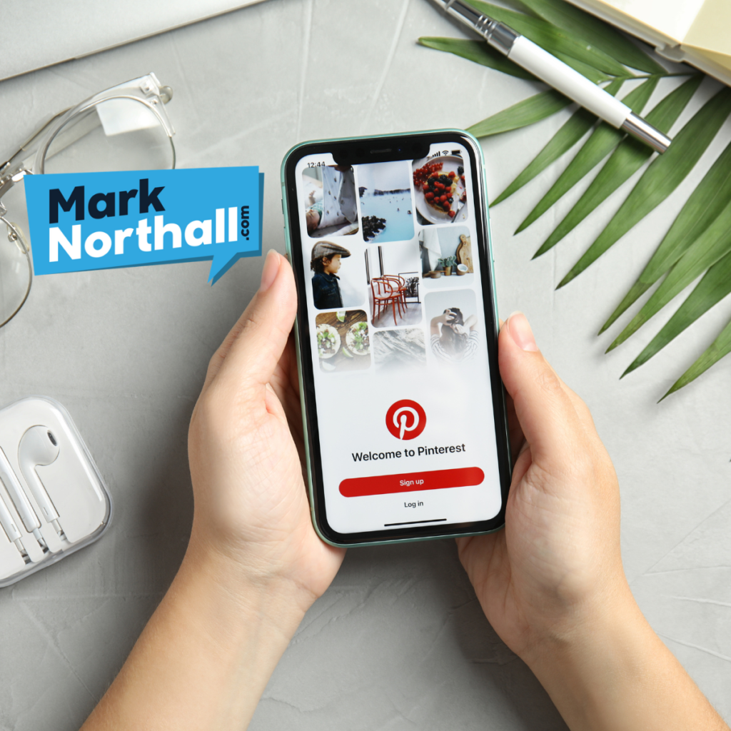 Mobile Phone with focus on Pinterest logo and marknorthall.com logo